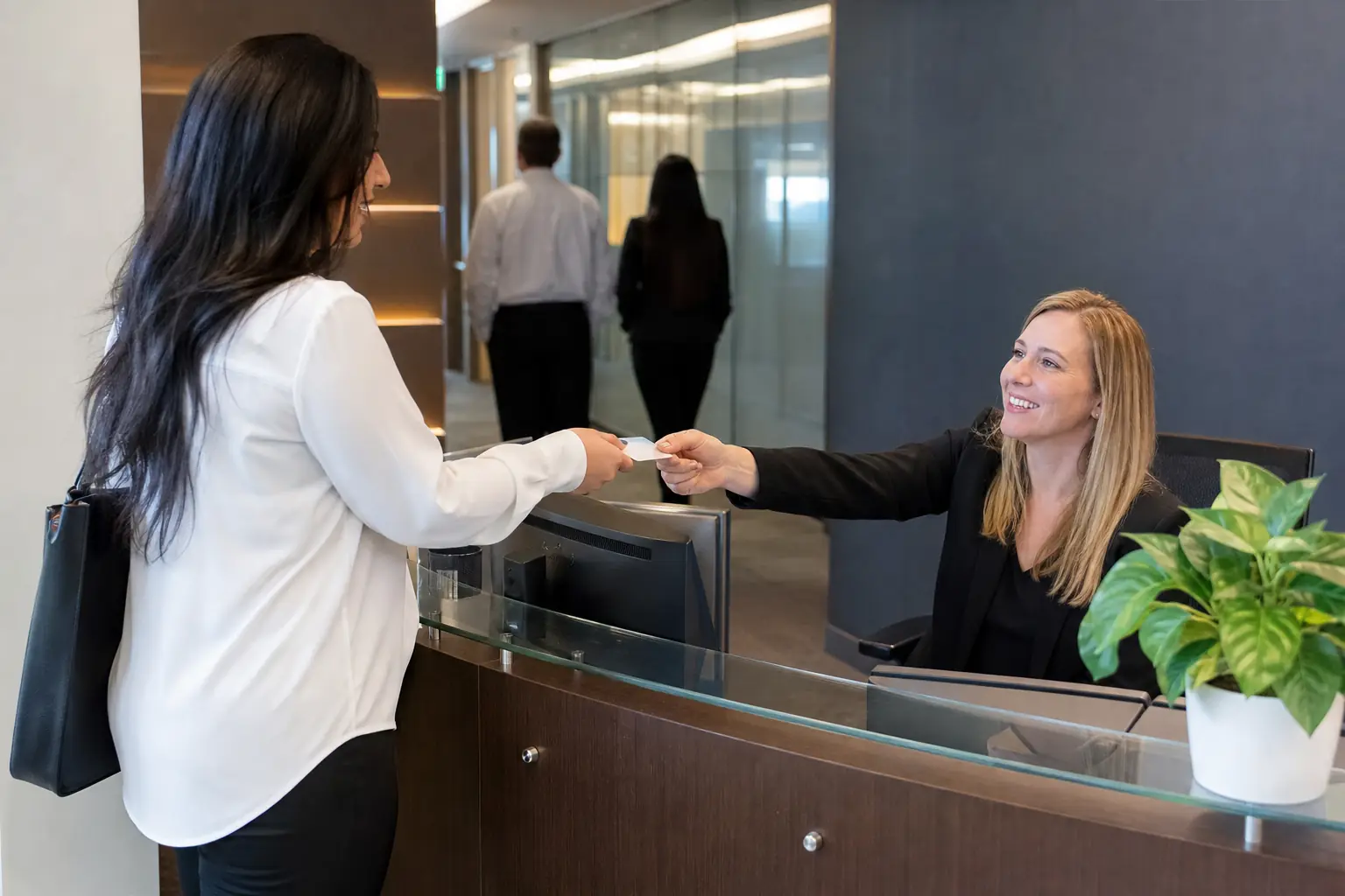 Staff reviewing a workplace visitor management workflow